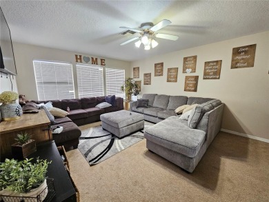 Set within the beautifully maintained and gated Remington Golf on Remington Golf Club in Florida - for sale on GolfHomes.com, golf home, golf lot