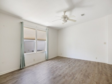 This 2004 2-bed, 2-bath split-plan home is nestled on a quiet on Barefoot Bay Golf Course in Florida - for sale on GolfHomes.com, golf home, golf lot