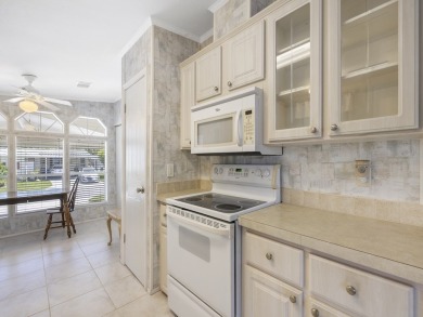 This 2004 2-bed, 2-bath split-plan home is nestled on a quiet on Barefoot Bay Golf Course in Florida - for sale on GolfHomes.com, golf home, golf lot