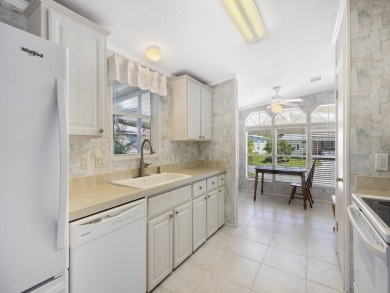 This 2004 2-bed, 2-bath split-plan home is nestled on a quiet on Barefoot Bay Golf Course in Florida - for sale on GolfHomes.com, golf home, golf lot
