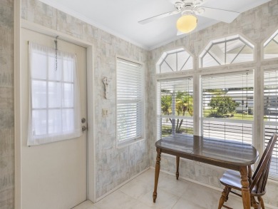 This 2004 2-bed, 2-bath split-plan home is nestled on a quiet on Barefoot Bay Golf Course in Florida - for sale on GolfHomes.com, golf home, golf lot