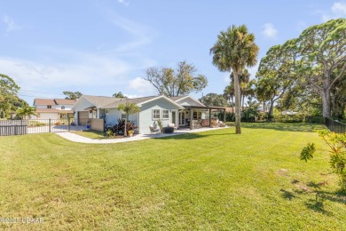 Canal-front gem is a rare find that promises the lifestyle on Hidden Lakes Golf Club in Florida - for sale on GolfHomes.com, golf home, golf lot