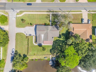 Canal-front gem is a rare find that promises the lifestyle on Hidden Lakes Golf Club in Florida - for sale on GolfHomes.com, golf home, golf lot