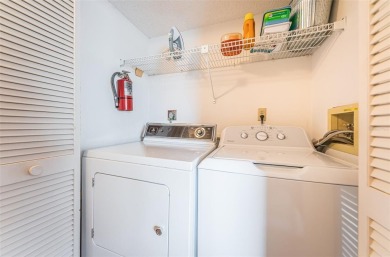 This ground-floor condo with 2 bedrooms and 2 bathrooms embodies on Isla Del Sol Yacht and Country Club in Florida - for sale on GolfHomes.com, golf home, golf lot