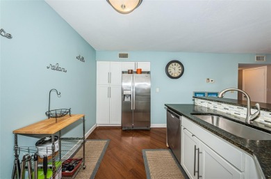 This ground-floor condo with 2 bedrooms and 2 bathrooms embodies on Isla Del Sol Yacht and Country Club in Florida - for sale on GolfHomes.com, golf home, golf lot