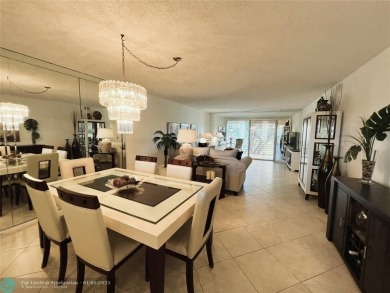 EXPANSIVE GOLF/WATER/CLUBHOUSE VIEW from this Favored LUXURY on Wynmoor Golf Course in Florida - for sale on GolfHomes.com, golf home, golf lot