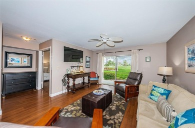 This ground-floor condo with 2 bedrooms and 2 bathrooms embodies on Isla Del Sol Yacht and Country Club in Florida - for sale on GolfHomes.com, golf home, golf lot