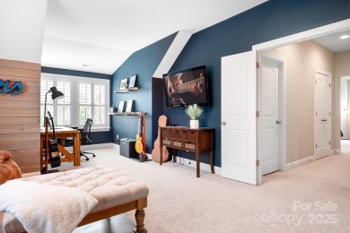 This exquisite home offers a unique blend of warm living spaces on Skybrook Golf Club in North Carolina - for sale on GolfHomes.com, golf home, golf lot
