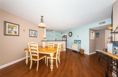 This ground-floor condo with 2 bedrooms and 2 bathrooms embodies on Isla Del Sol Yacht and Country Club in Florida - for sale on GolfHomes.com, golf home, golf lot