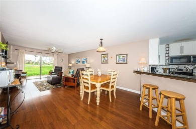 This ground-floor condo with 2 bedrooms and 2 bathrooms embodies on Isla Del Sol Yacht and Country Club in Florida - for sale on GolfHomes.com, golf home, golf lot