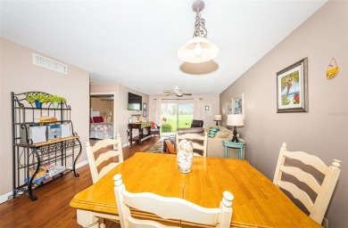 This ground-floor condo with 2 bedrooms and 2 bathrooms embodies on Isla Del Sol Yacht and Country Club in Florida - for sale on GolfHomes.com, golf home, golf lot