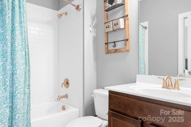 This exquisite home offers a unique blend of warm living spaces on Skybrook Golf Club in North Carolina - for sale on GolfHomes.com, golf home, golf lot