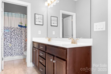This exquisite home offers a unique blend of warm living spaces on Skybrook Golf Club in North Carolina - for sale on GolfHomes.com, golf home, golf lot