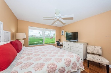 This ground-floor condo with 2 bedrooms and 2 bathrooms embodies on Isla Del Sol Yacht and Country Club in Florida - for sale on GolfHomes.com, golf home, golf lot