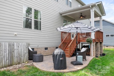 This exquisite home offers a unique blend of warm living spaces on Skybrook Golf Club in North Carolina - for sale on GolfHomes.com, golf home, golf lot