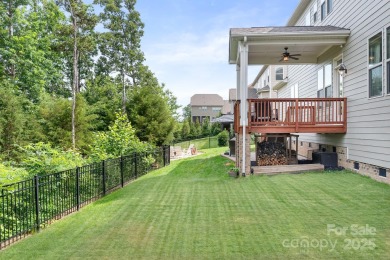 This exquisite home offers a unique blend of warm living spaces on Skybrook Golf Club in North Carolina - for sale on GolfHomes.com, golf home, golf lot