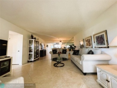 EXPANSIVE GOLF/WATER/CLUBHOUSE VIEW from this Favored LUXURY on Wynmoor Golf Course in Florida - for sale on GolfHomes.com, golf home, golf lot