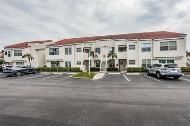 This ground-floor condo with 2 bedrooms and 2 bathrooms embodies on Isla Del Sol Yacht and Country Club in Florida - for sale on GolfHomes.com, golf home, golf lot