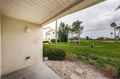 This ground-floor condo with 2 bedrooms and 2 bathrooms embodies on Isla Del Sol Yacht and Country Club in Florida - for sale on GolfHomes.com, golf home, golf lot