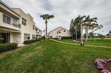 This ground-floor condo with 2 bedrooms and 2 bathrooms embodies on Isla Del Sol Yacht and Country Club in Florida - for sale on GolfHomes.com, golf home, golf lot