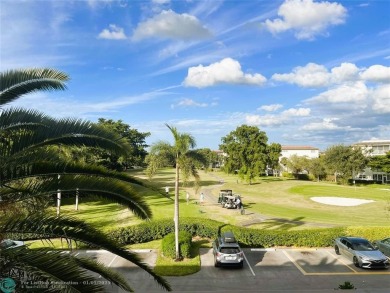 EXPANSIVE GOLF/WATER/CLUBHOUSE VIEW from this Favored LUXURY on Wynmoor Golf Course in Florida - for sale on GolfHomes.com, golf home, golf lot