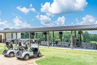 This exquisite home offers a unique blend of warm living spaces on Skybrook Golf Club in North Carolina - for sale on GolfHomes.com, golf home, golf lot