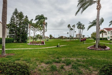This ground-floor condo with 2 bedrooms and 2 bathrooms embodies on Isla Del Sol Yacht and Country Club in Florida - for sale on GolfHomes.com, golf home, golf lot