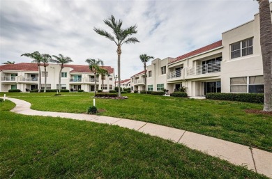 This ground-floor condo with 2 bedrooms and 2 bathrooms embodies on Isla Del Sol Yacht and Country Club in Florida - for sale on GolfHomes.com, golf home, golf lot