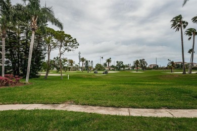 This ground-floor condo with 2 bedrooms and 2 bathrooms embodies on Isla Del Sol Yacht and Country Club in Florida - for sale on GolfHomes.com, golf home, golf lot