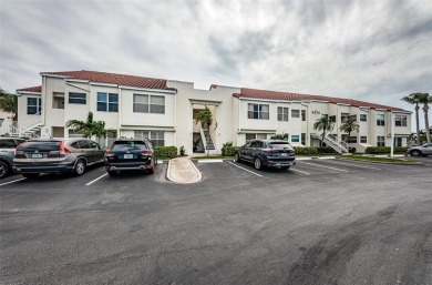 This ground-floor condo with 2 bedrooms and 2 bathrooms embodies on Isla Del Sol Yacht and Country Club in Florida - for sale on GolfHomes.com, golf home, golf lot