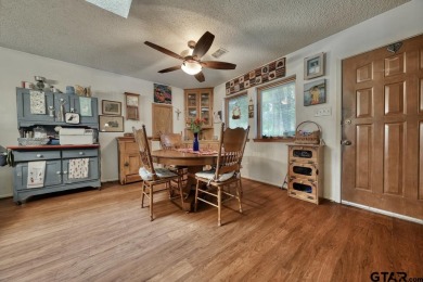 Nestled in the serene community of Hideaway Lake, this charming on Hide-A-Way Lake Golf Course in Texas - for sale on GolfHomes.com, golf home, golf lot