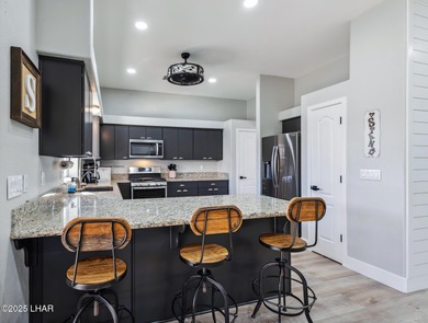 Immaculate south side Havasu home on a quiet street between the on London Bridge Golf Course in Arizona - for sale on GolfHomes.com, golf home, golf lot