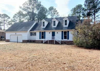 Discover this attractive two-story home boasting loads of curb on River Bend Golf and Country Club in North Carolina - for sale on GolfHomes.com, golf home, golf lot