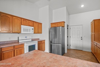 Located in a welcoming golf course community right off Route 66 on Valle Vista Golf Course in Arizona - for sale on GolfHomes.com, golf home, golf lot