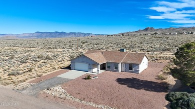 Located in a welcoming golf course community right off Route 66 on Valle Vista Golf Course in Arizona - for sale on GolfHomes.com, golf home, golf lot