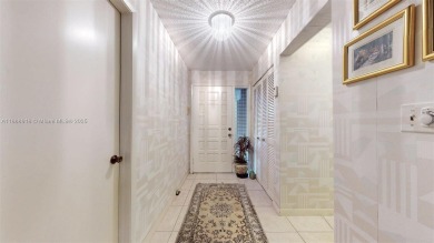 Charming and impeccably maintained 2-bedroom, 2-bath townhouse on Jim McLean Signature Course in Florida - for sale on GolfHomes.com, golf home, golf lot