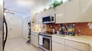 Charming and impeccably maintained 2-bedroom, 2-bath townhouse on Jim McLean Signature Course in Florida - for sale on GolfHomes.com, golf home, golf lot