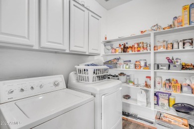 Welcome to this spacious two-story home that has it all! From on The Golf Club At Johnson Ranch in Arizona - for sale on GolfHomes.com, golf home, golf lot