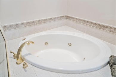 LUXURY LIVING ON THE GREEN in Regatta Bay - Stunning Views on Regatta Bay Golf and Country Club in Florida - for sale on GolfHomes.com, golf home, golf lot