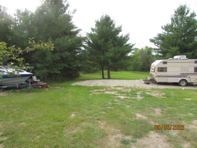 Beautiful camping or building lot that is ready to camp on this on Sugar Springs Country Club in Michigan - for sale on GolfHomes.com, golf home, golf lot
