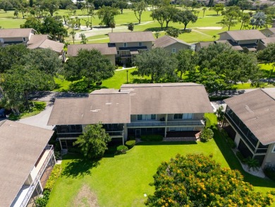 Beautifully updated, open concept 1/1.5 with 24' porcelain tile on Riverbend Golf Club in Florida - for sale on GolfHomes.com, golf home, golf lot