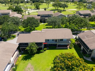 Beautifully updated, open concept 1/1.5 with 24' porcelain tile on Riverbend Golf Club in Florida - for sale on GolfHomes.com, golf home, golf lot