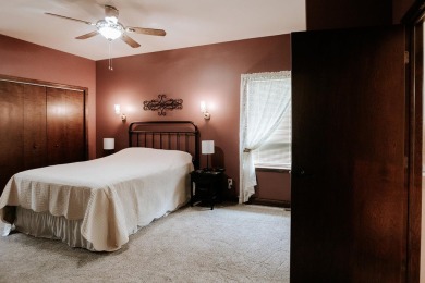 This beautifully maintained ranch home sits on over half an acre on The Ridge Golf Club in Iowa - for sale on GolfHomes.com, golf home, golf lot