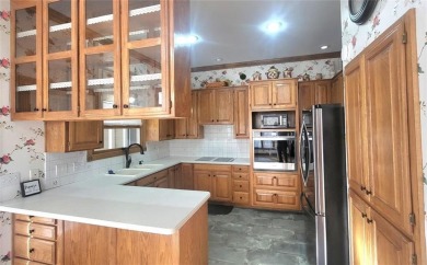 This beautifully made home right on the golf course is a on Holiday Island Golf Course in Arkansas - for sale on GolfHomes.com, golf home, golf lot