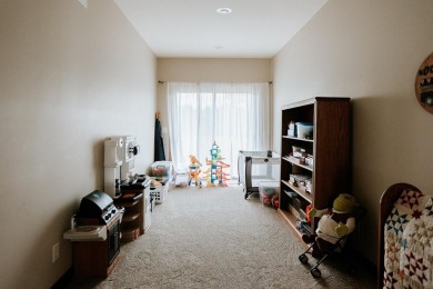This beautifully maintained ranch home sits on over half an acre on The Ridge Golf Club in Iowa - for sale on GolfHomes.com, golf home, golf lot