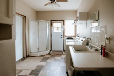 This beautifully maintained ranch home sits on over half an acre on The Ridge Golf Club in Iowa - for sale on GolfHomes.com, golf home, golf lot