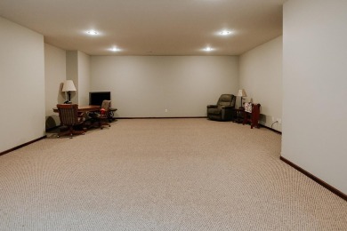 This beautifully maintained ranch home sits on over half an acre on The Ridge Golf Club in Iowa - for sale on GolfHomes.com, golf home, golf lot