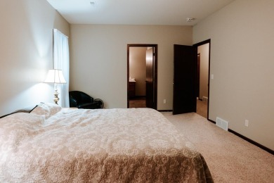 This beautifully maintained ranch home sits on over half an acre on The Ridge Golf Club in Iowa - for sale on GolfHomes.com, golf home, golf lot