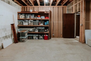 This beautifully maintained ranch home sits on over half an acre on The Ridge Golf Club in Iowa - for sale on GolfHomes.com, golf home, golf lot