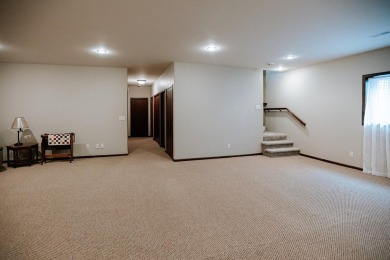 This beautifully maintained ranch home sits on over half an acre on The Ridge Golf Club in Iowa - for sale on GolfHomes.com, golf home, golf lot